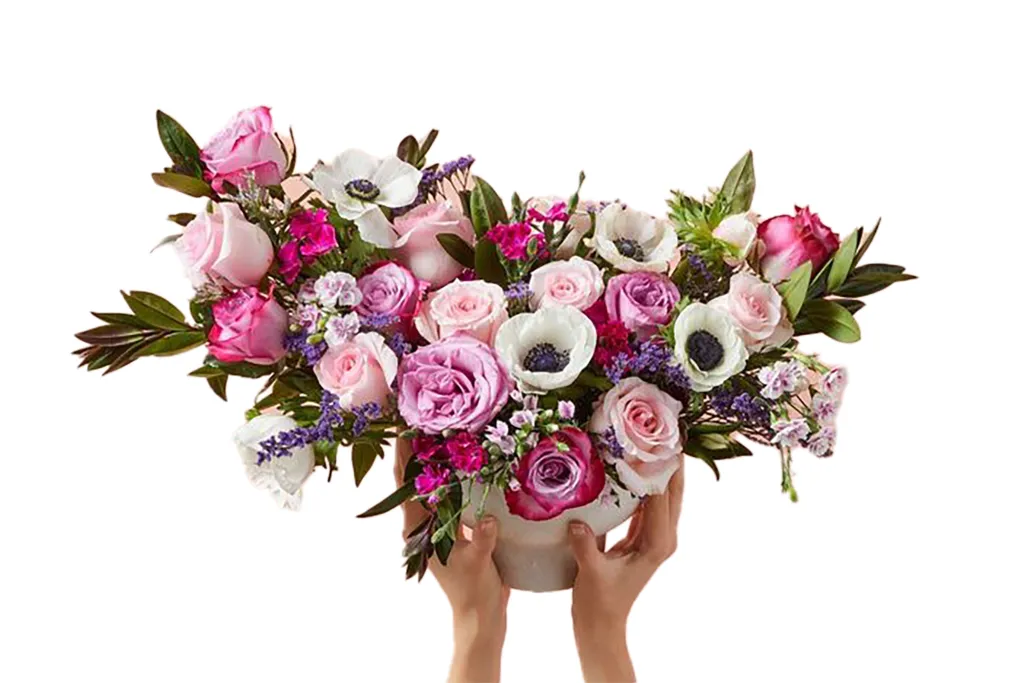 A person holding a bouquet of flowers