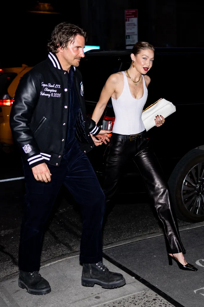 Bradley Cooper and Gigi Hadid walk side-by-side in Midtown, New York City.