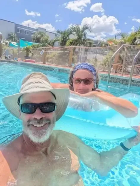 Brian and Lynette Hooker in a swimming pool.