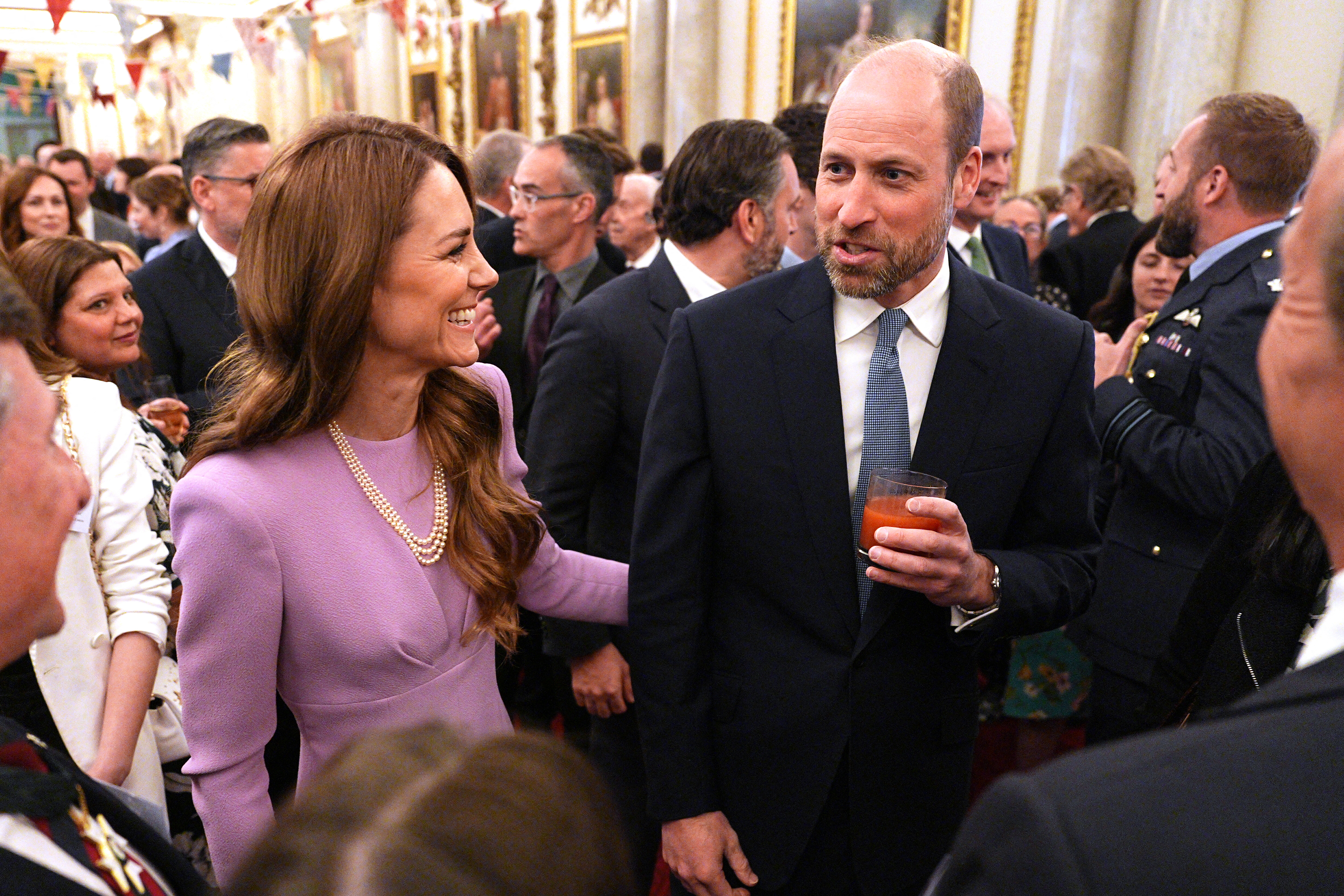 Catherine, Princess of Wales and Prince William, Prince of Wales, attending a reception.