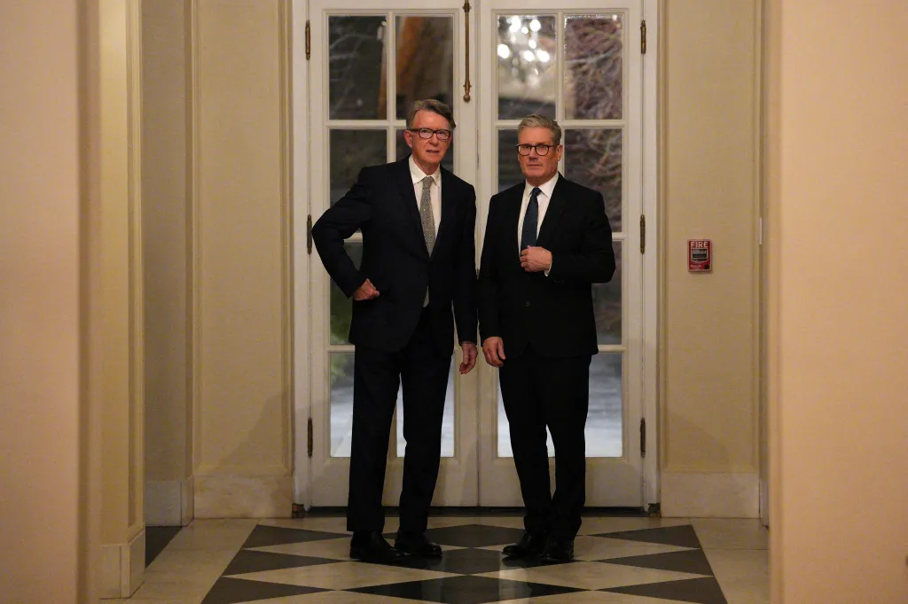 British Prime Minister Keir Starmer and Britain's ambassador to the United States Peter Mandelson stand in a room in Washington, DC.