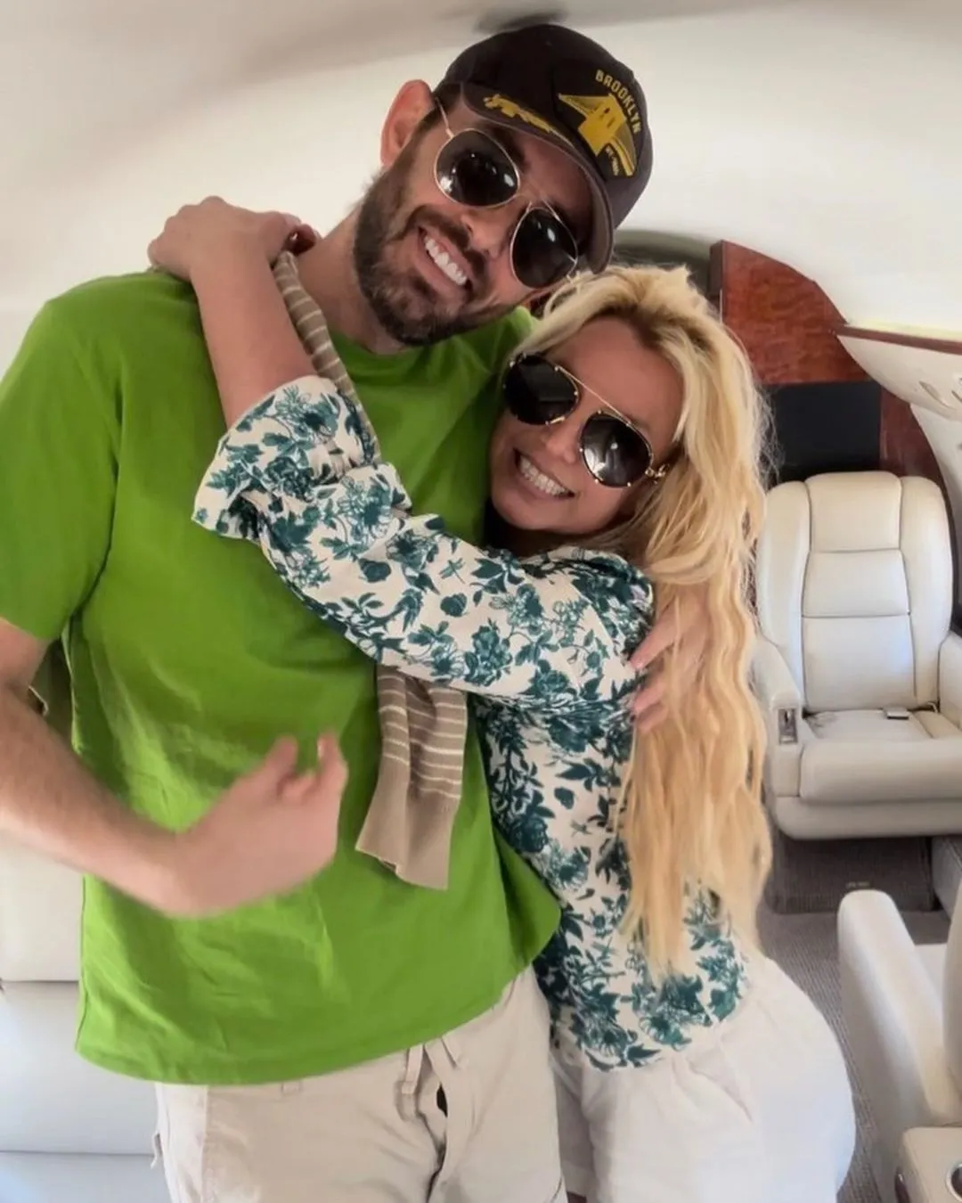 Britney Spears and Cade Hudson hugging on a private jet.