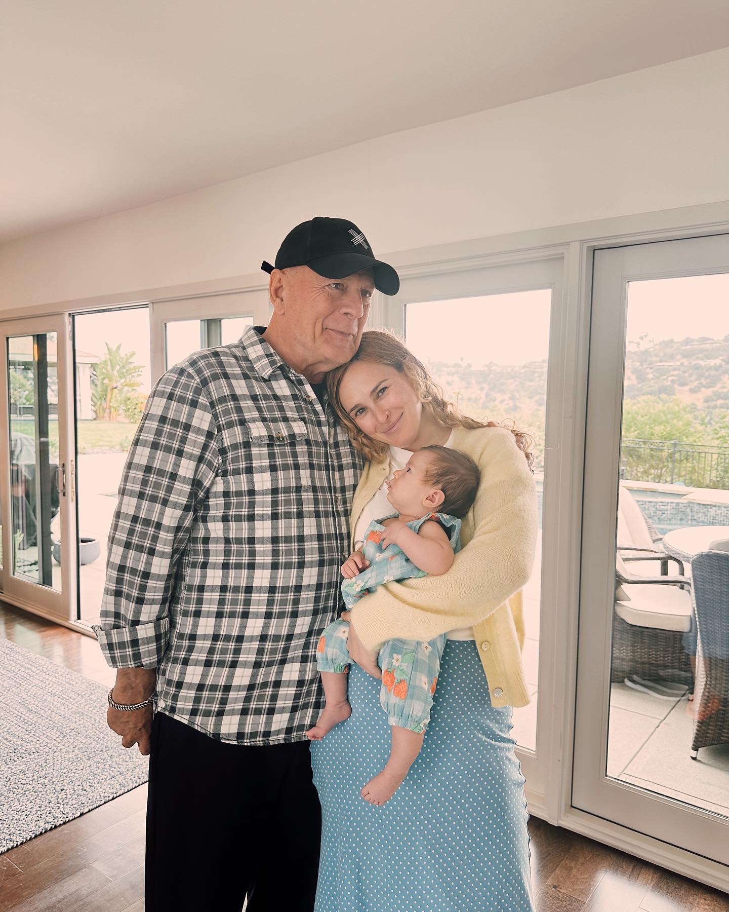 Bruce Willis with his daughter Rumer and her baby.