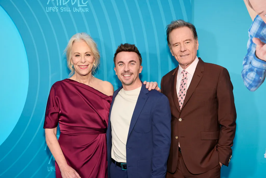 Jane Kaczmarek, Frankie Muniz, and Bryan Cranston smiling at the 