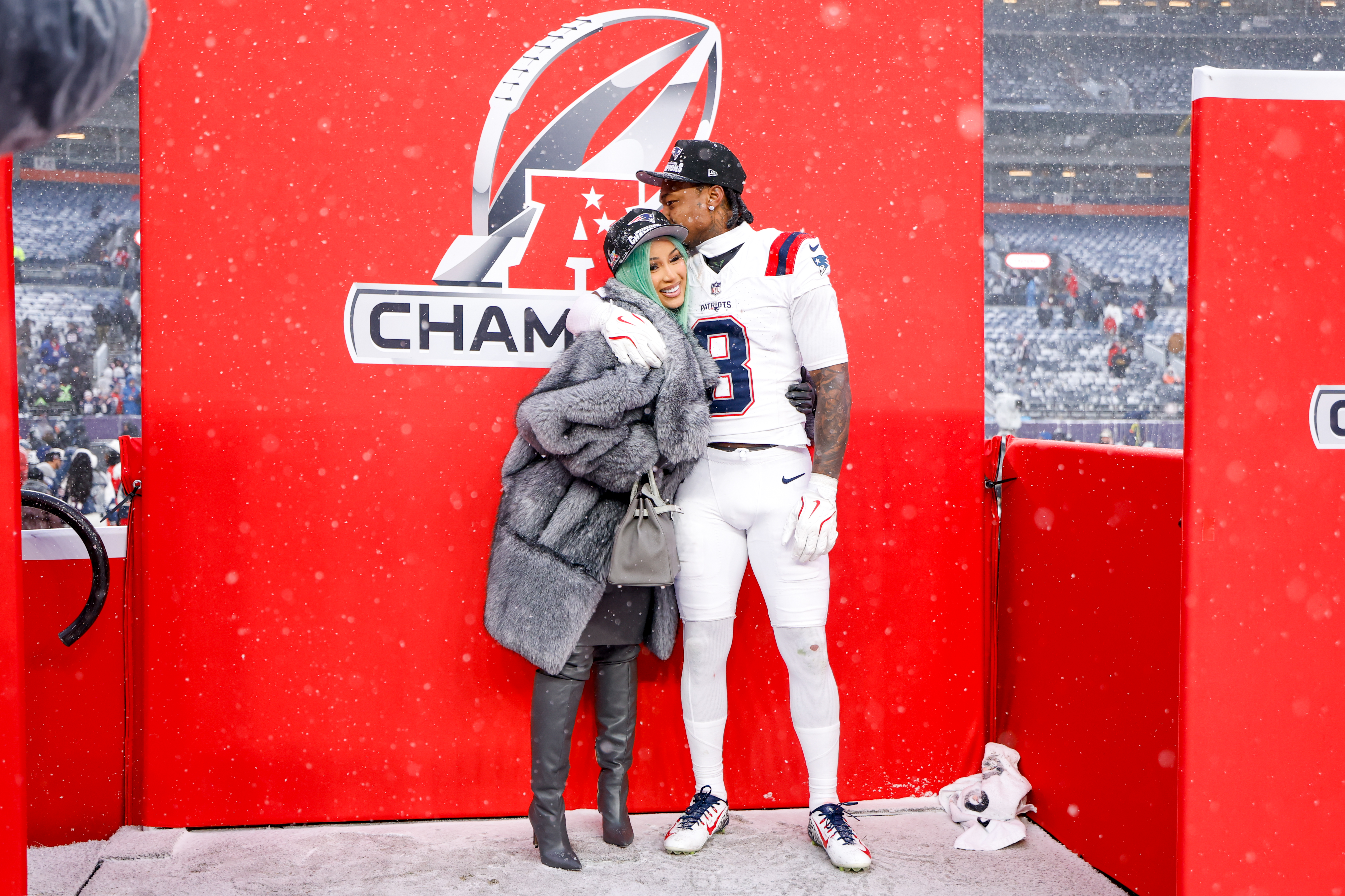 Cardi B and Stefon Diggs #8 of the New England Patriots pose for a portrait after the AFC Championship game.