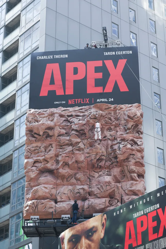 Charlize Theron is seen after climbing a wall to promote her new Netflix movie "Apex" 