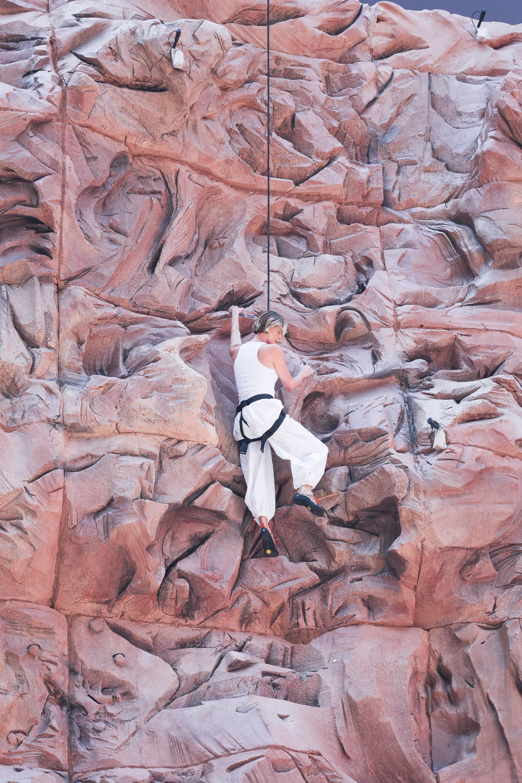 Charlize Theron is seen after climbing a wall to promote her new Netflix movie "Apex" 