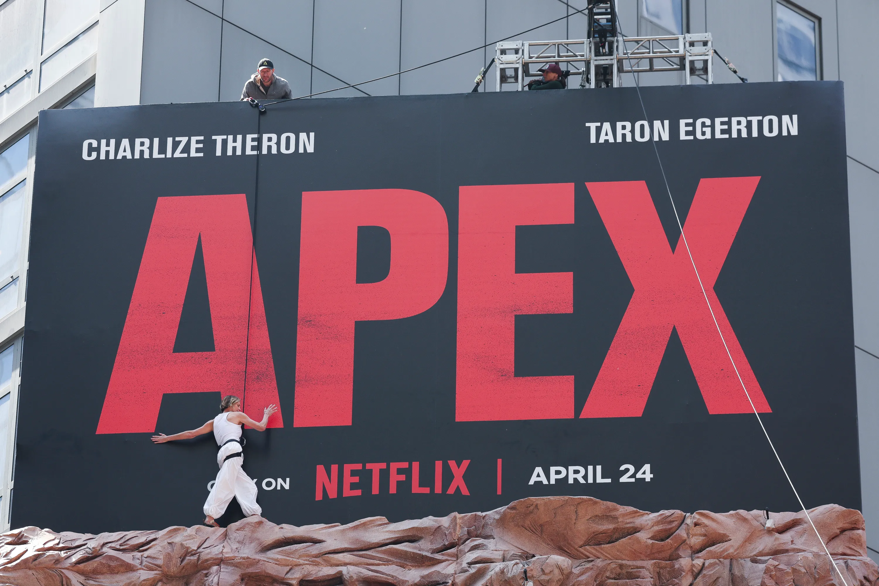 Charlize Theron is seen after climbing a wall to promote her new Netflix movie "Apex" 
