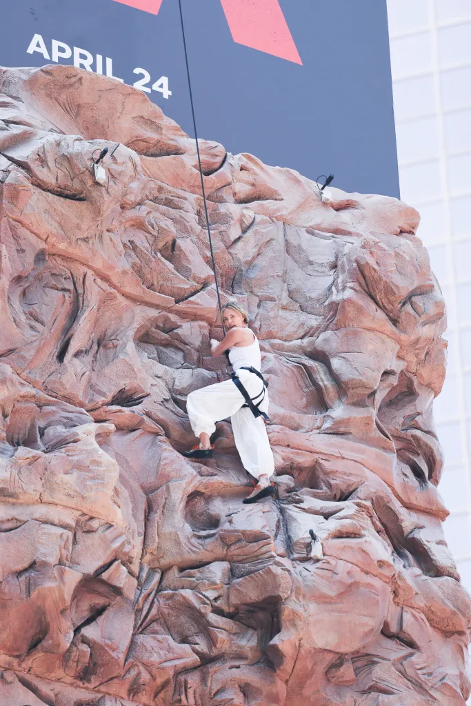 Charlize Theron is seen after climbing a wall to promote her new Netflix movie "Apex" 