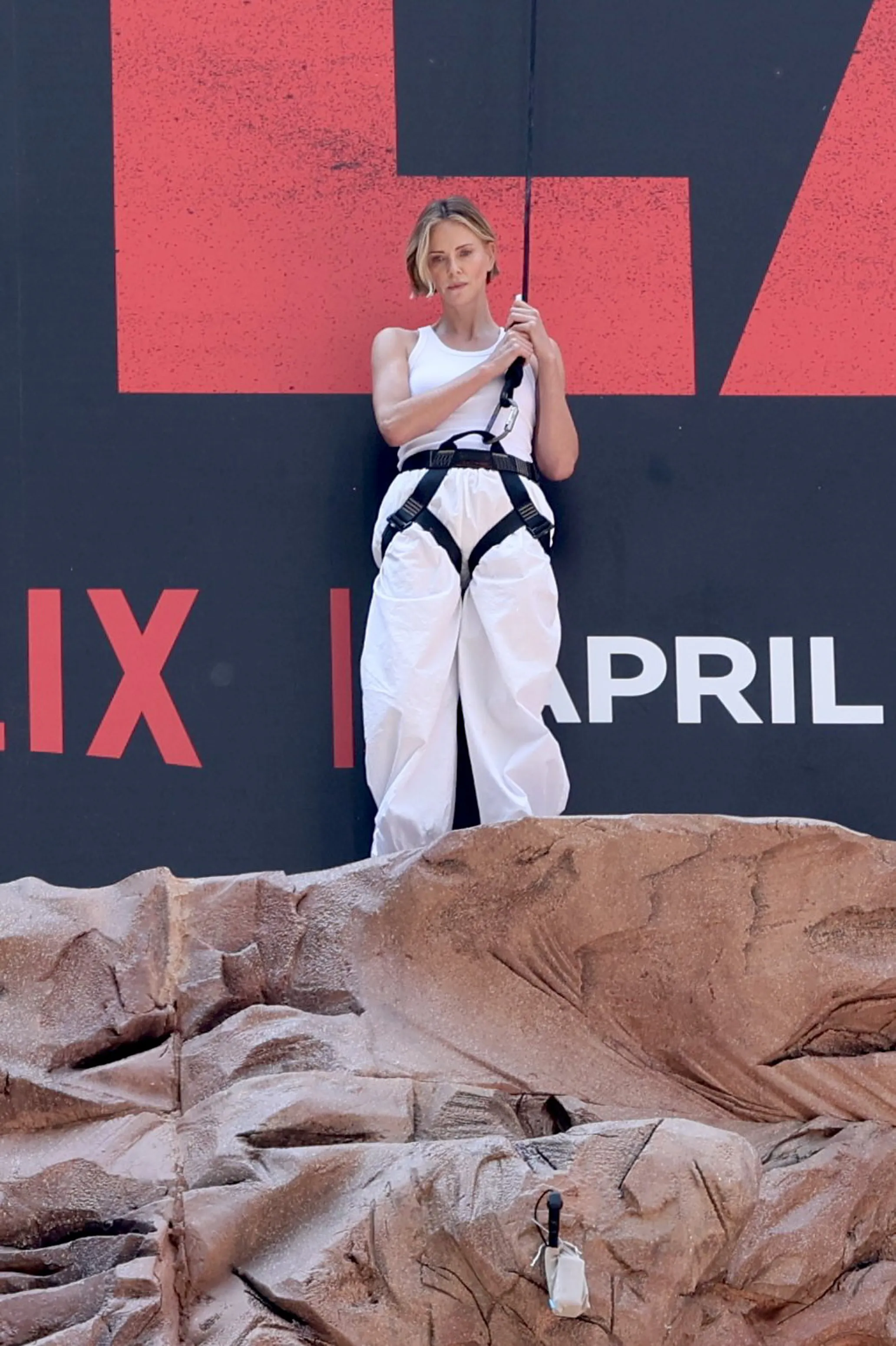 Charlize Theron is seen after climbing a wall to promote her new Netflix movie "Apex" 
