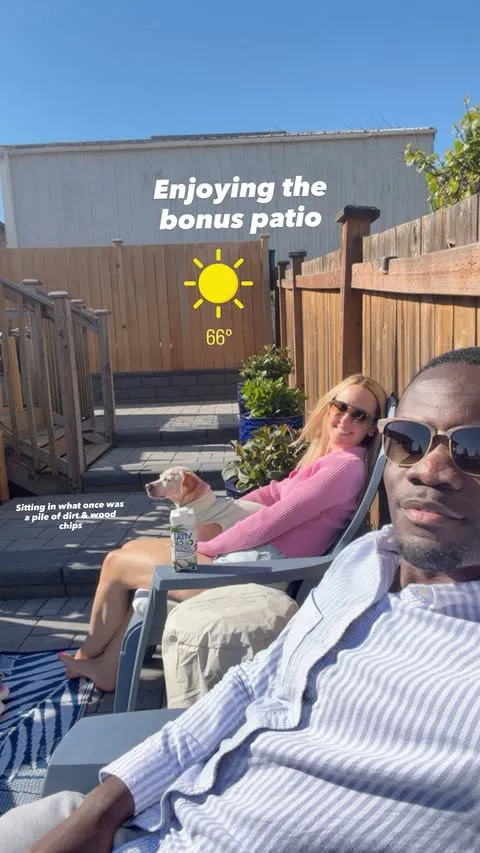 Chelsea Griffin, her husband Kwame Appiah, and their dog relaxing on a sunny patio.