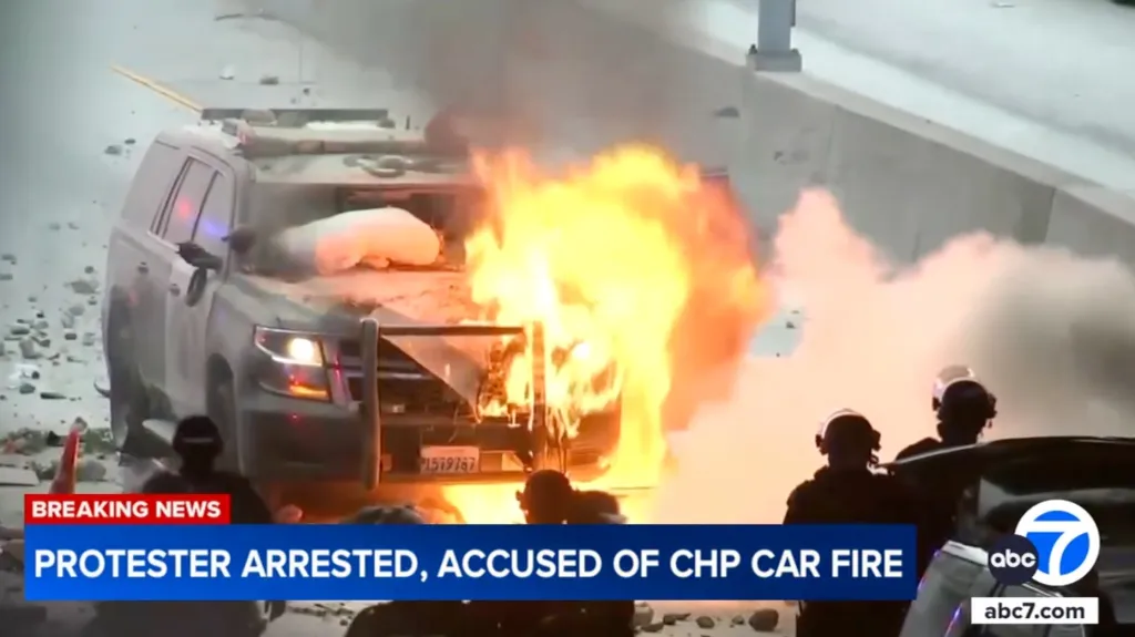 CHP patrol car on fire with an ABC 7 news banner stating "PROTESTER ARRESTED, ACCUSED OF CHP CAR FIRE."