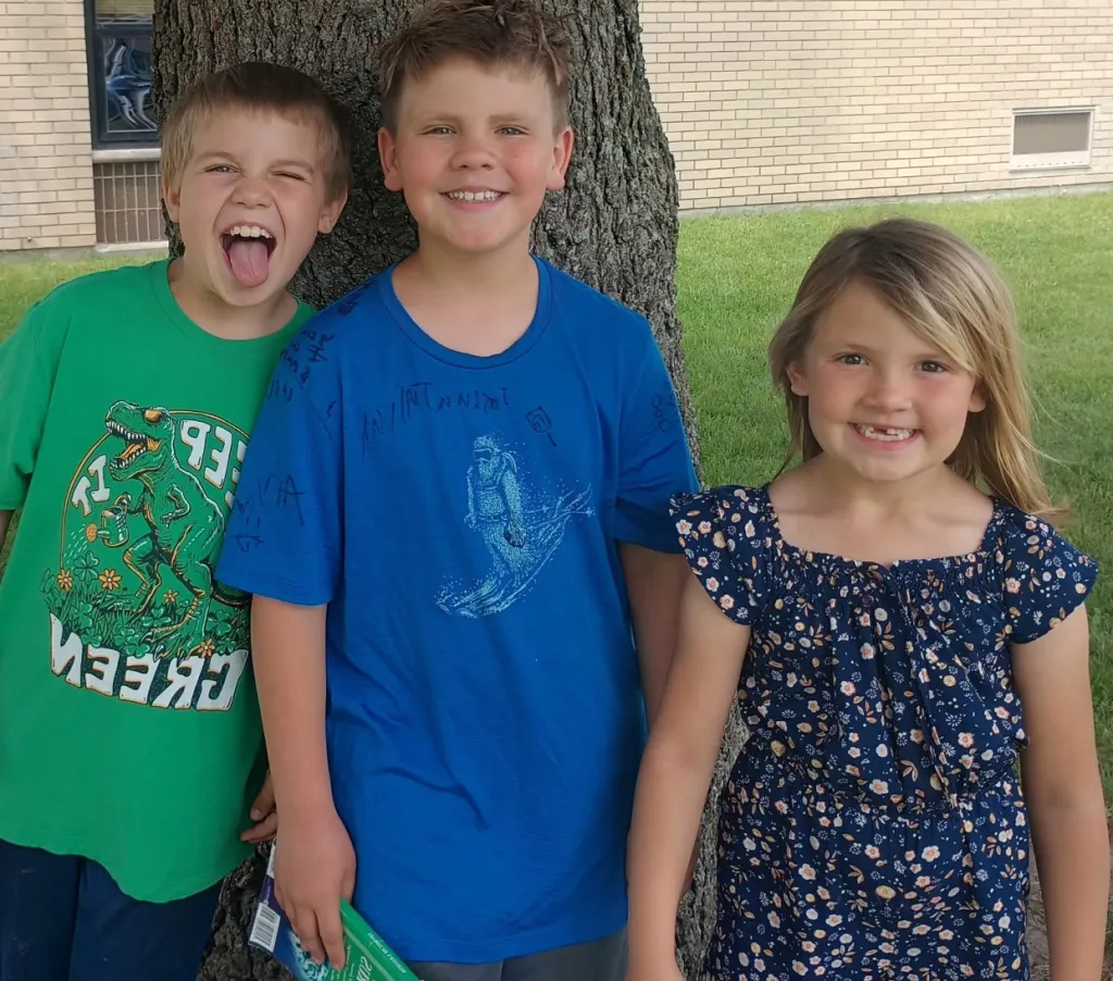 Connor, Rylee, and Alena Kanni smiling for a picture.