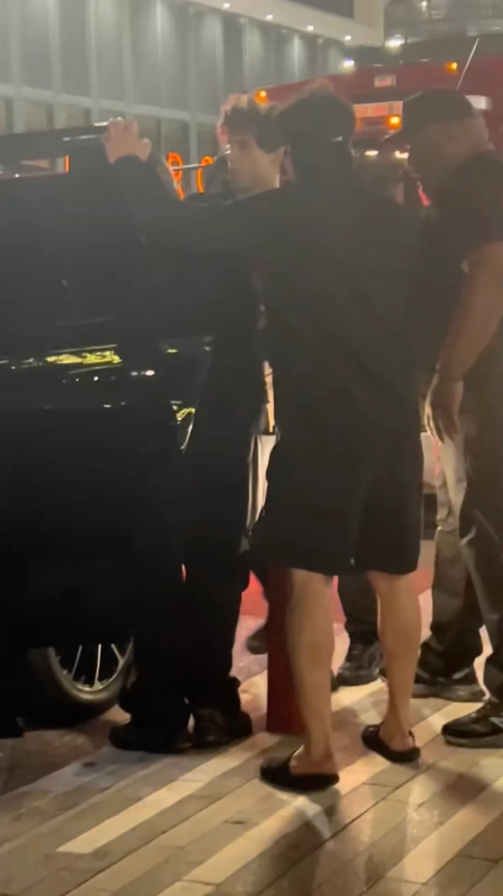 Braden Peters being put into a vehicle next to a Miami-Dade Fire Rescue truck.