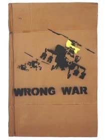 Illustration of a helicopter with the text "WRONG WAR" on a cardboard box.