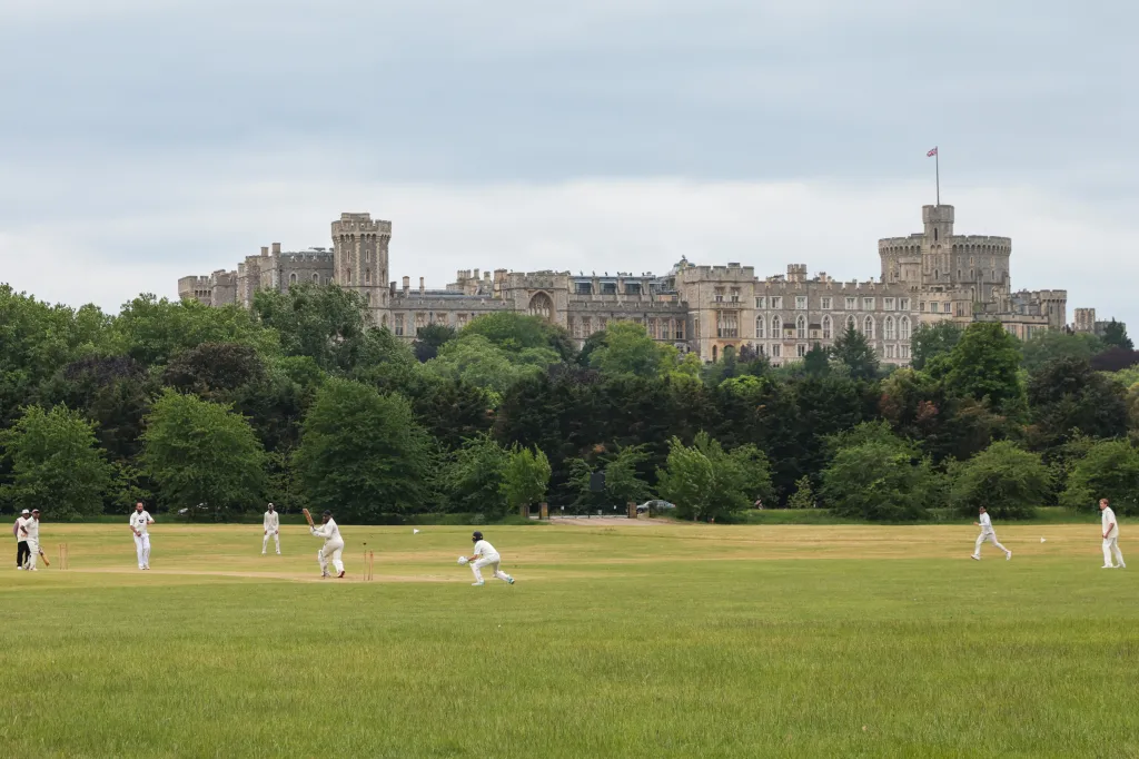 Cricket match in Home Park with Windsor Castle in the background.