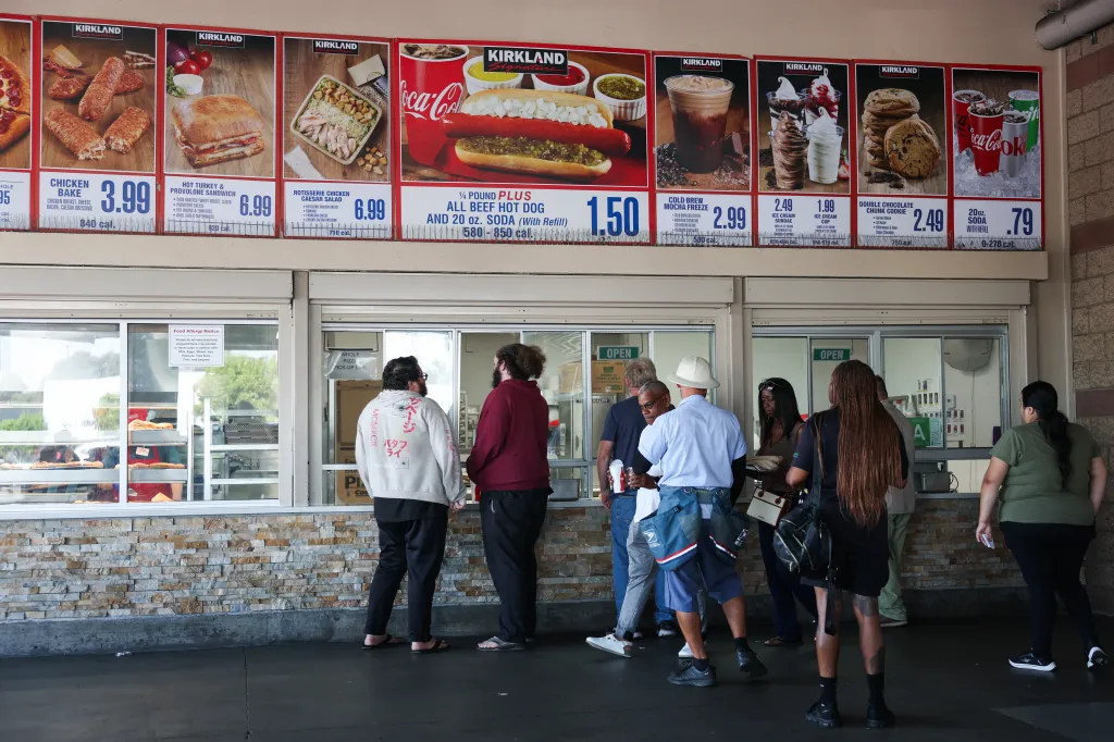 Customers wait in line at Costco's food court. 