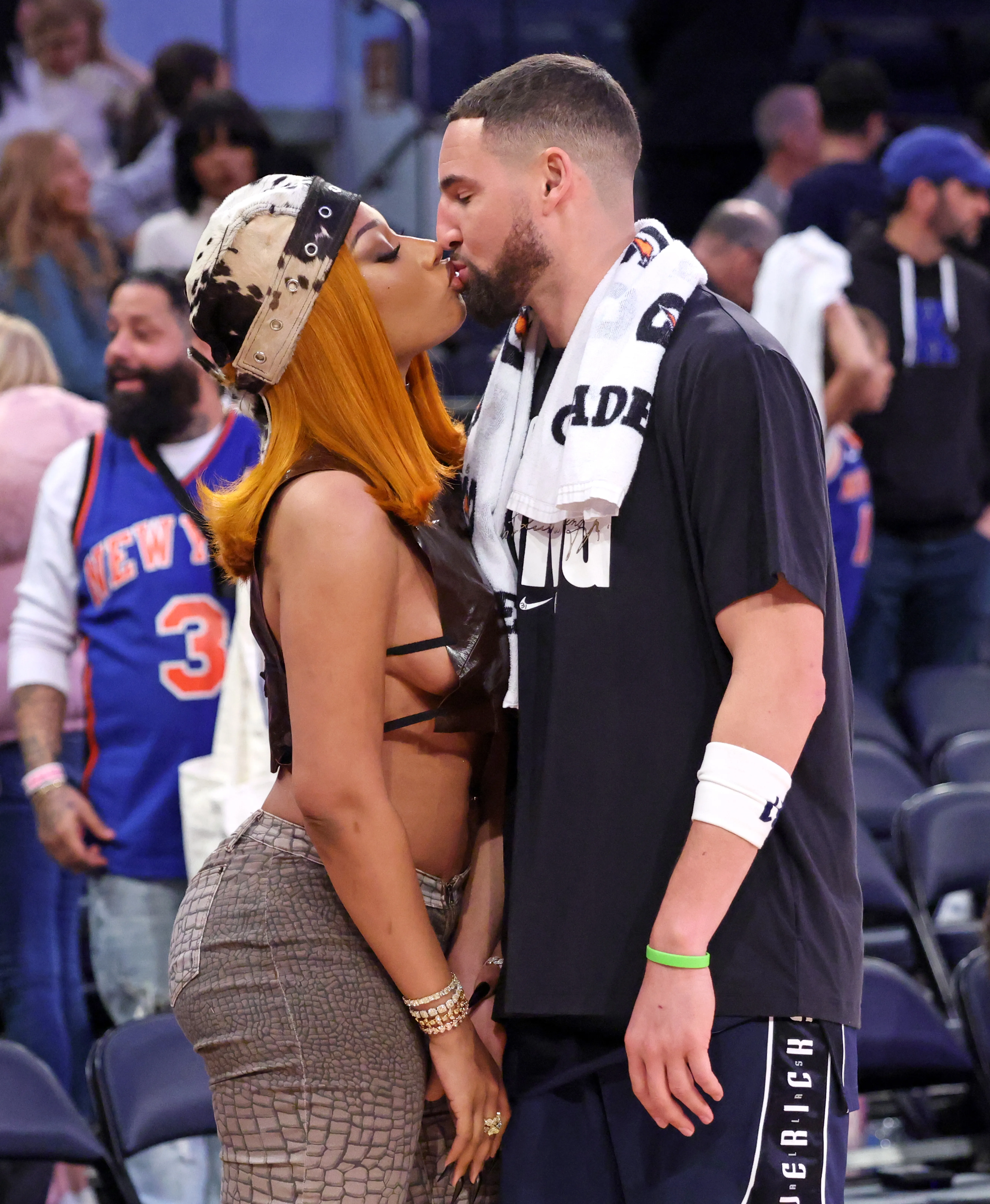 Music artist Megan Thee Stallion kisses Dallas Mavericks guard Klay Thompson at Madison Square Garden.