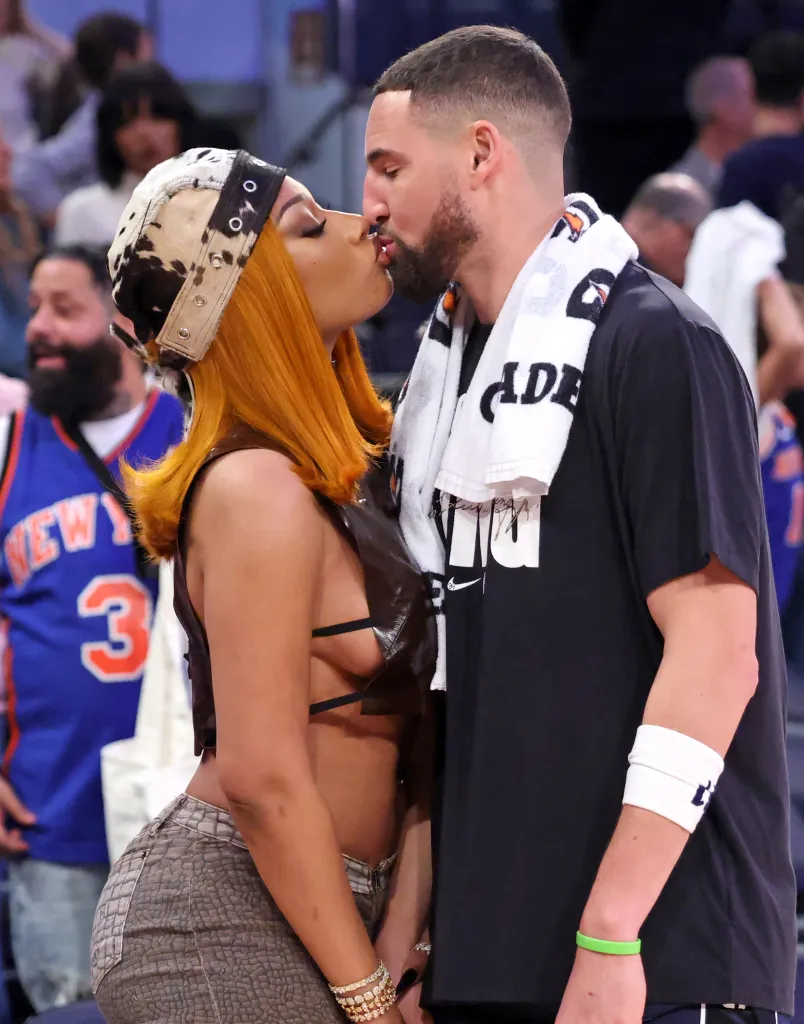Megan Thee Stallion kisses Dallas Mavericks guard Klay Thompson.