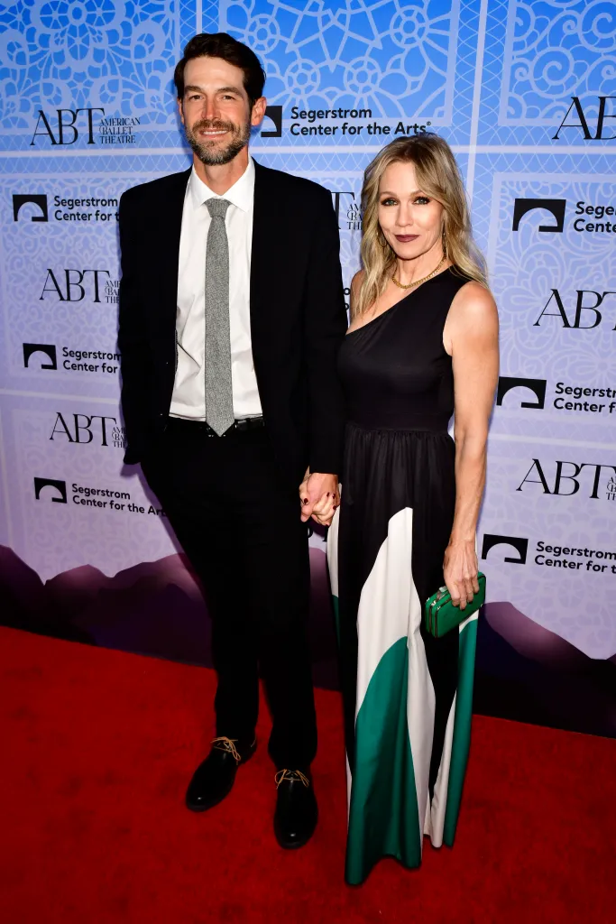 Dave Abrams, in a black suit, white shirt and white tie, and Jennie Garth, in a one shoulder black dress, attend the North American premiere of the ballet "Like Water For Chocolate" hosted by The American Ballet Theater.