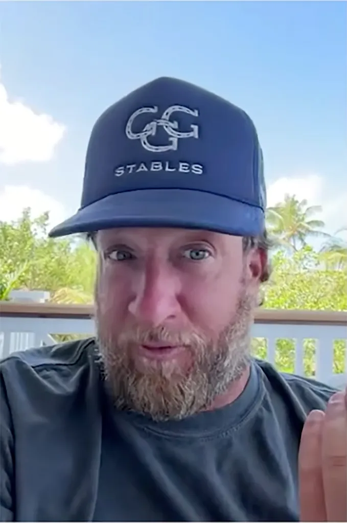 Dave Portnoy wearing a navy blue cap with "GG STABLES" embroidered on it.