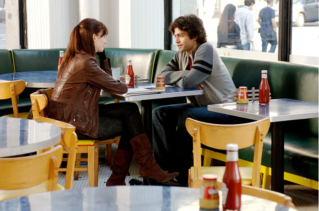 Anne Hathaway and Adrian Grenier in a restaurant scene from the film "The Devil Wears Prada."