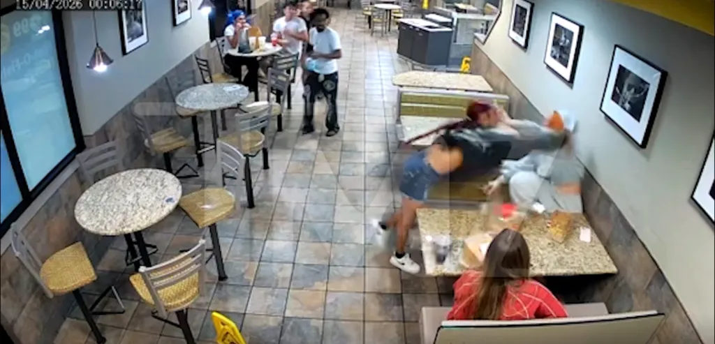 Video still of Ice Spice getting slapped by a customer at McDonald's.