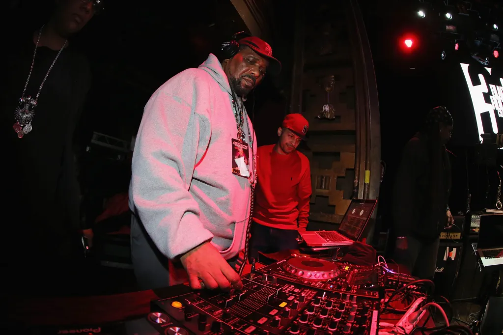 DJ Afrika Bambaataa performing at a benefit concert.