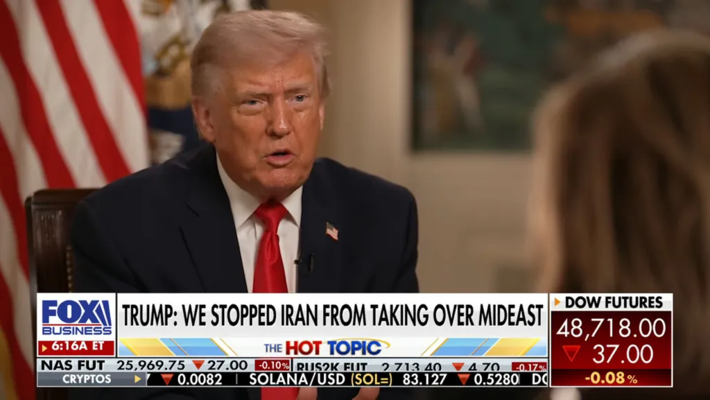 Donald Trump being interviewed on Fox Business with the chyron "TRUMP: WE STOPPED IRAN FROM TAKING OVER MIDEAST".