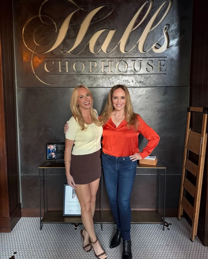 Catherine Bach (right) posing with another woman in front of a 