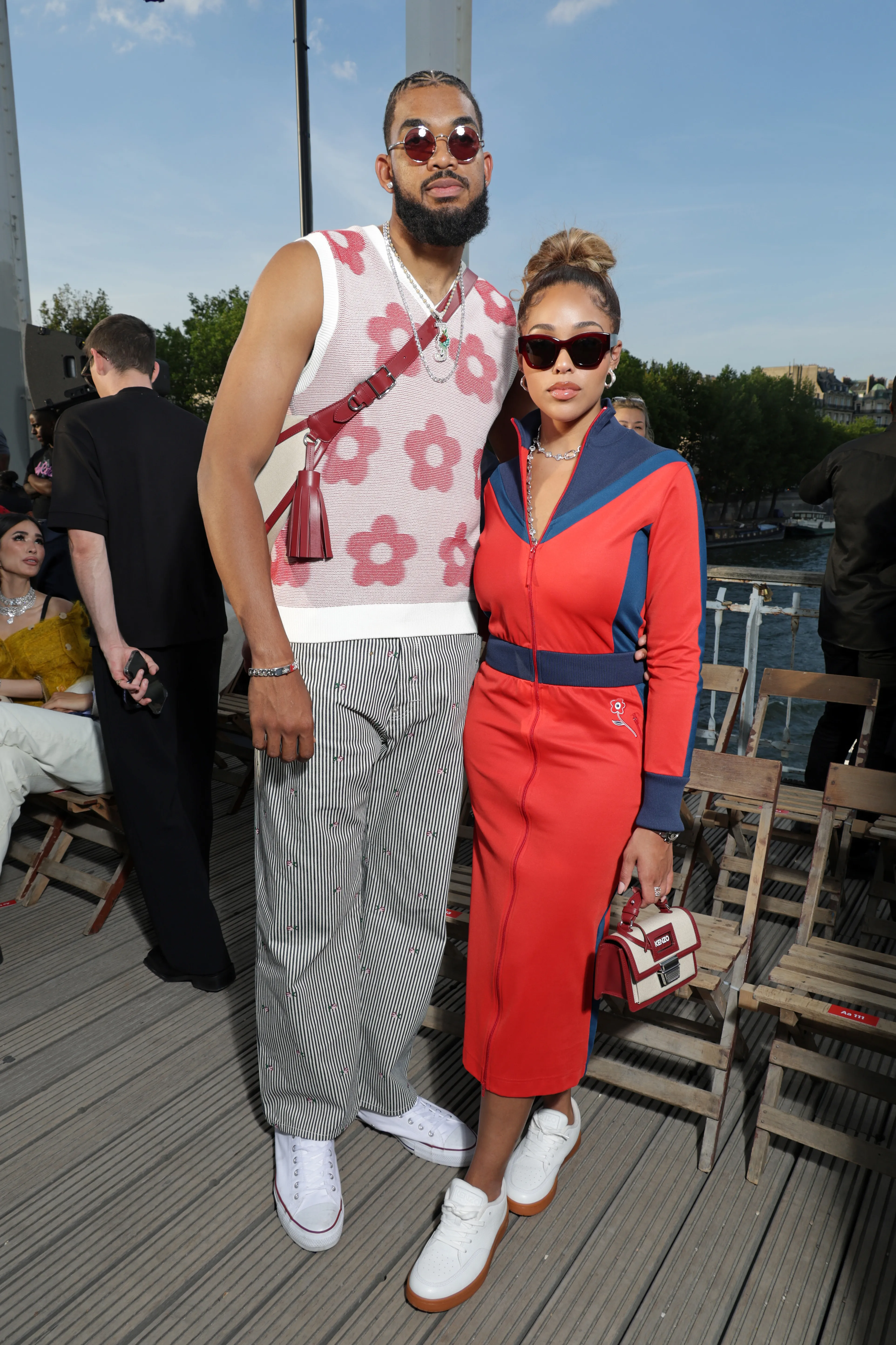 Karl-Anthony Towns and Jordyn Woods posing at the Kenzo Menswear Spring/Summer 2024 show in Paris.