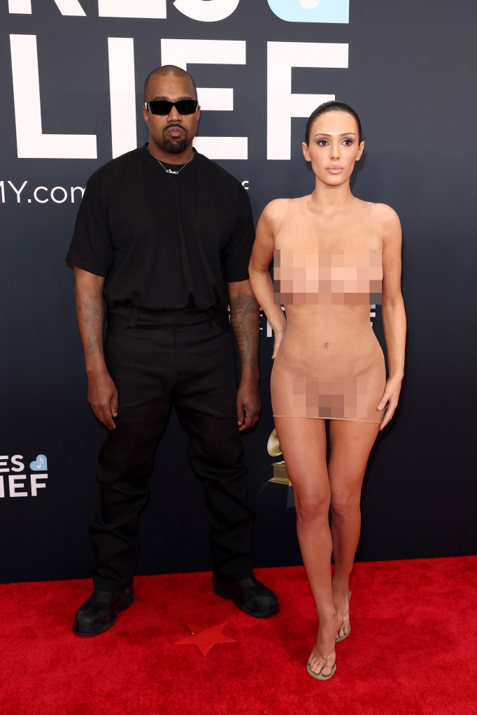 Kanye West in black and Bianca Censori in a sheer nude dress attend the 67th Annual GRAMMY Awards.