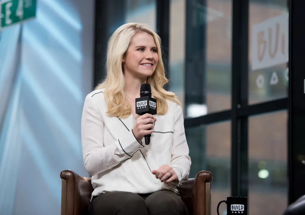 Elizabeth Smart smiling while speaking into a microphone at Build Studio.