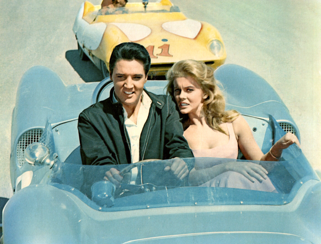 Elvis Presley and Ann-Margret driving a race car in a scene from "Viva Las Vegas."