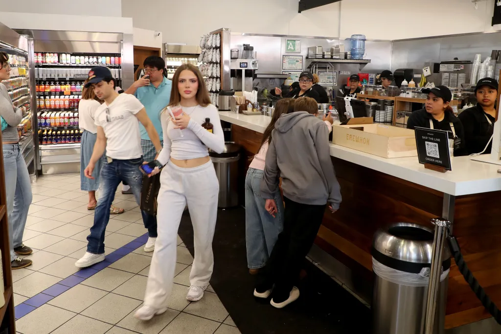 People gather at an Erewhon grocery store in Beverly Grove, California.