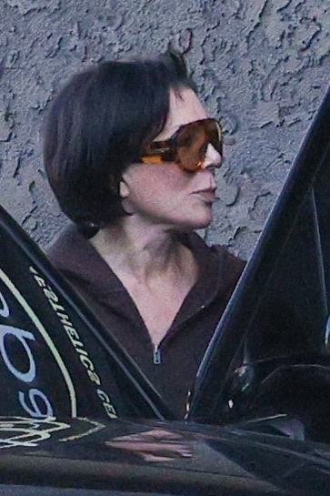 Kris Jenner in large sunglasses.
