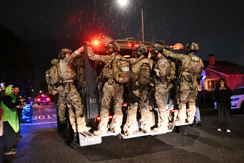 FBI officers leaving an address in Torrance, California, associated with Cole Tomas Allen.