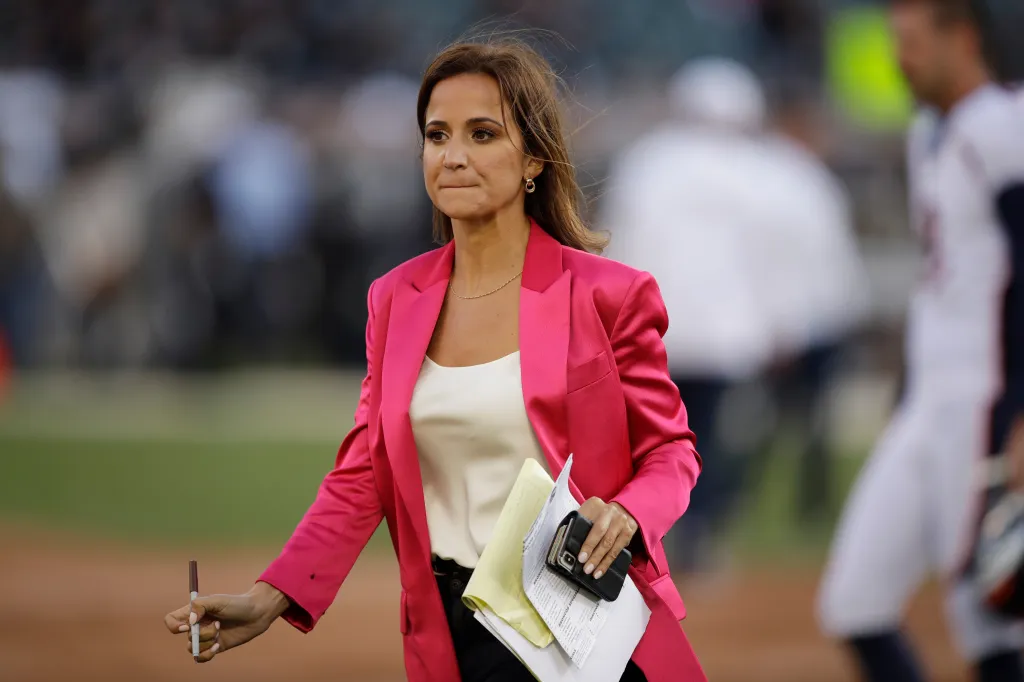 Dianna Russini, a reporter, on the sidelines before an NFL game.
