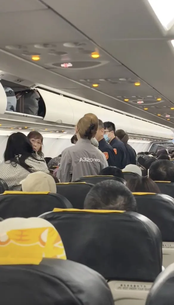 Crewmembers and authorities in the cabin.