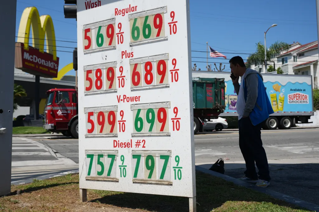 Gas prices are displayed on a sign in Los Angeles.