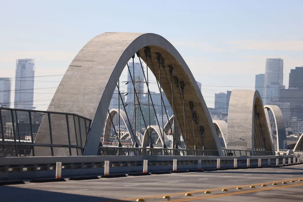 The 6th Street Bridge in downtown Los Angeles with its arches visible, showing damage to the light fittings.