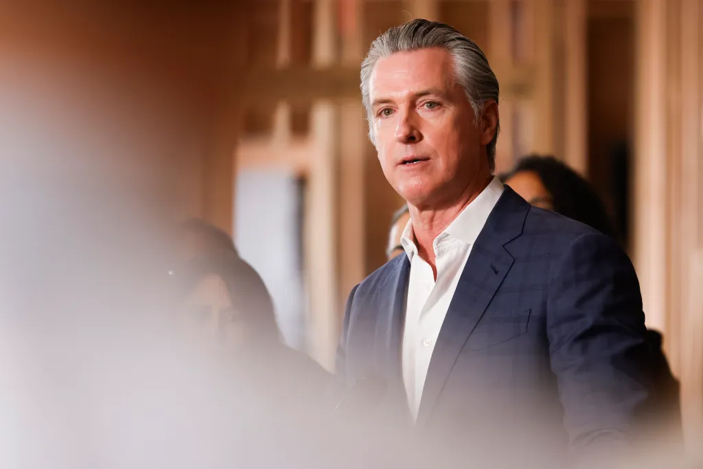 California Governor Gavin Newsom speaking at a press conference.