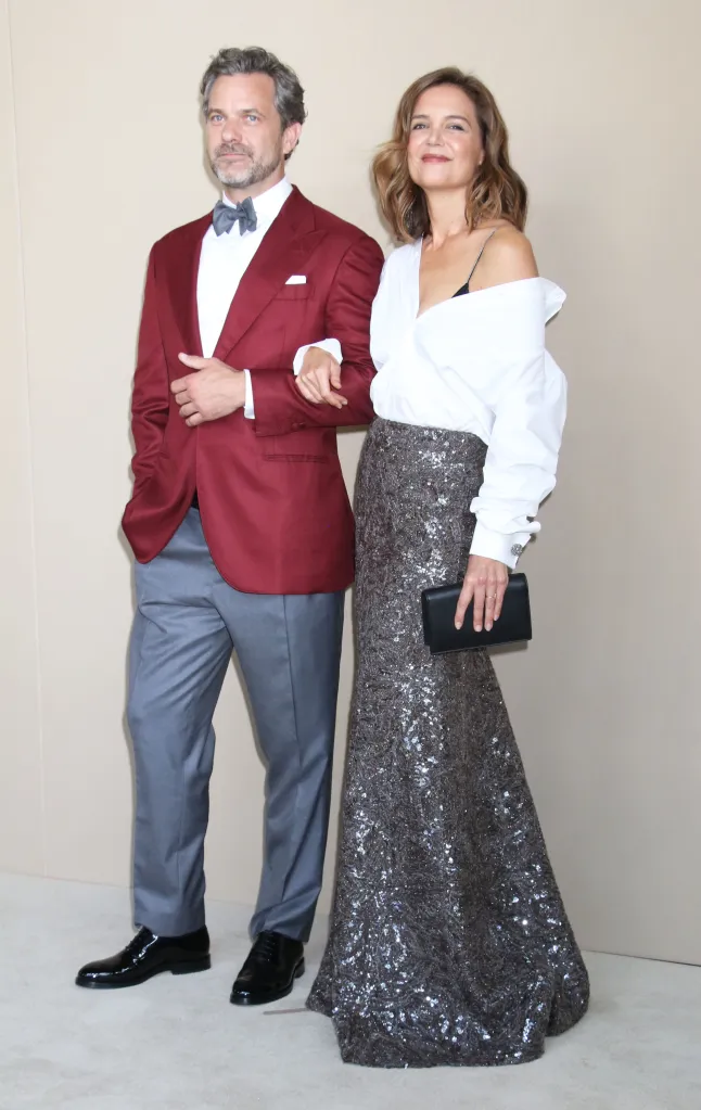 Joshua Jackson and Katie Holmes pose for a photo at a gala screening.