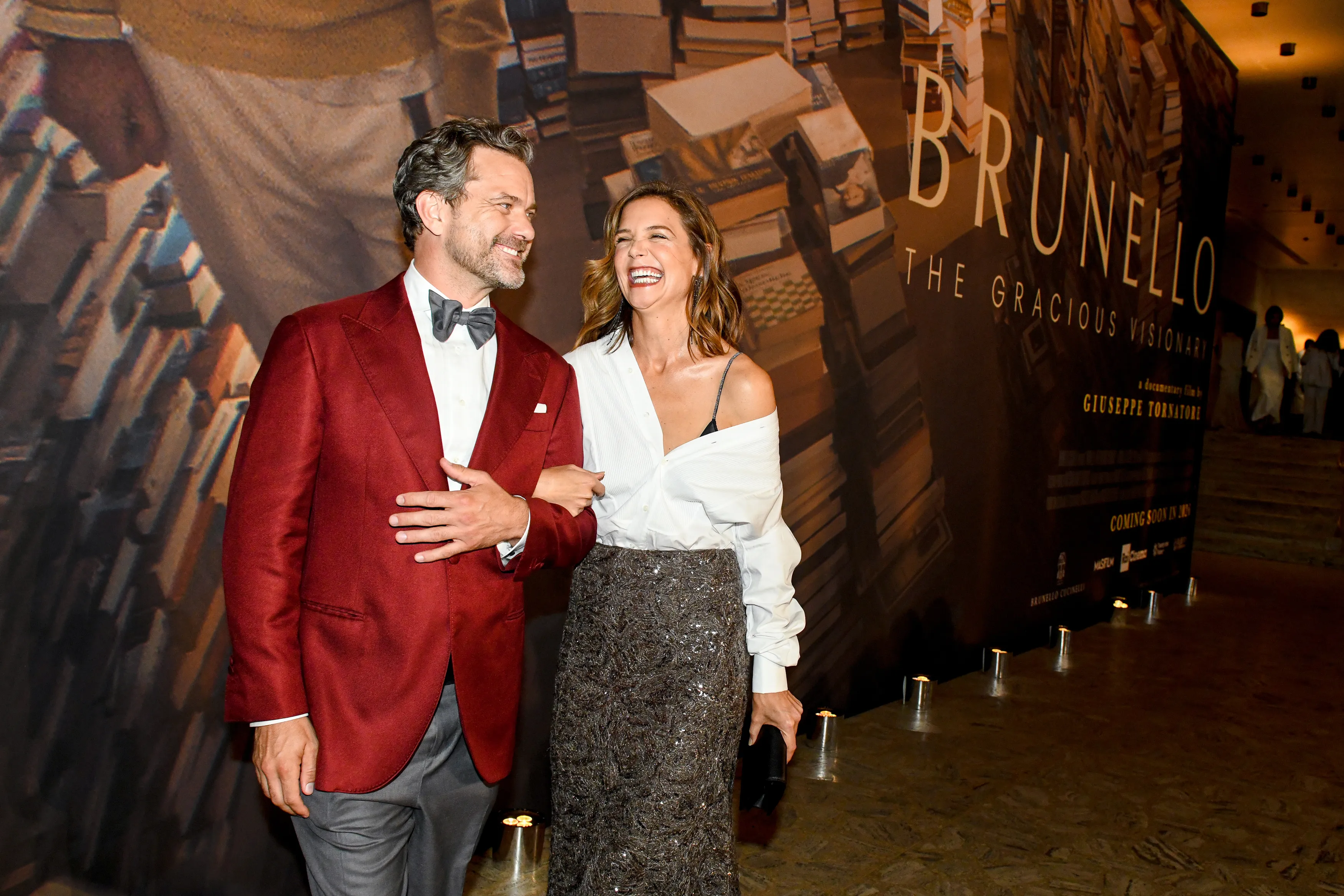 Joshua Jackson and Katie Holmes smiling at the Brunello Cucinelli gala screening of "The Gracious Visionary" at Lincoln Center.