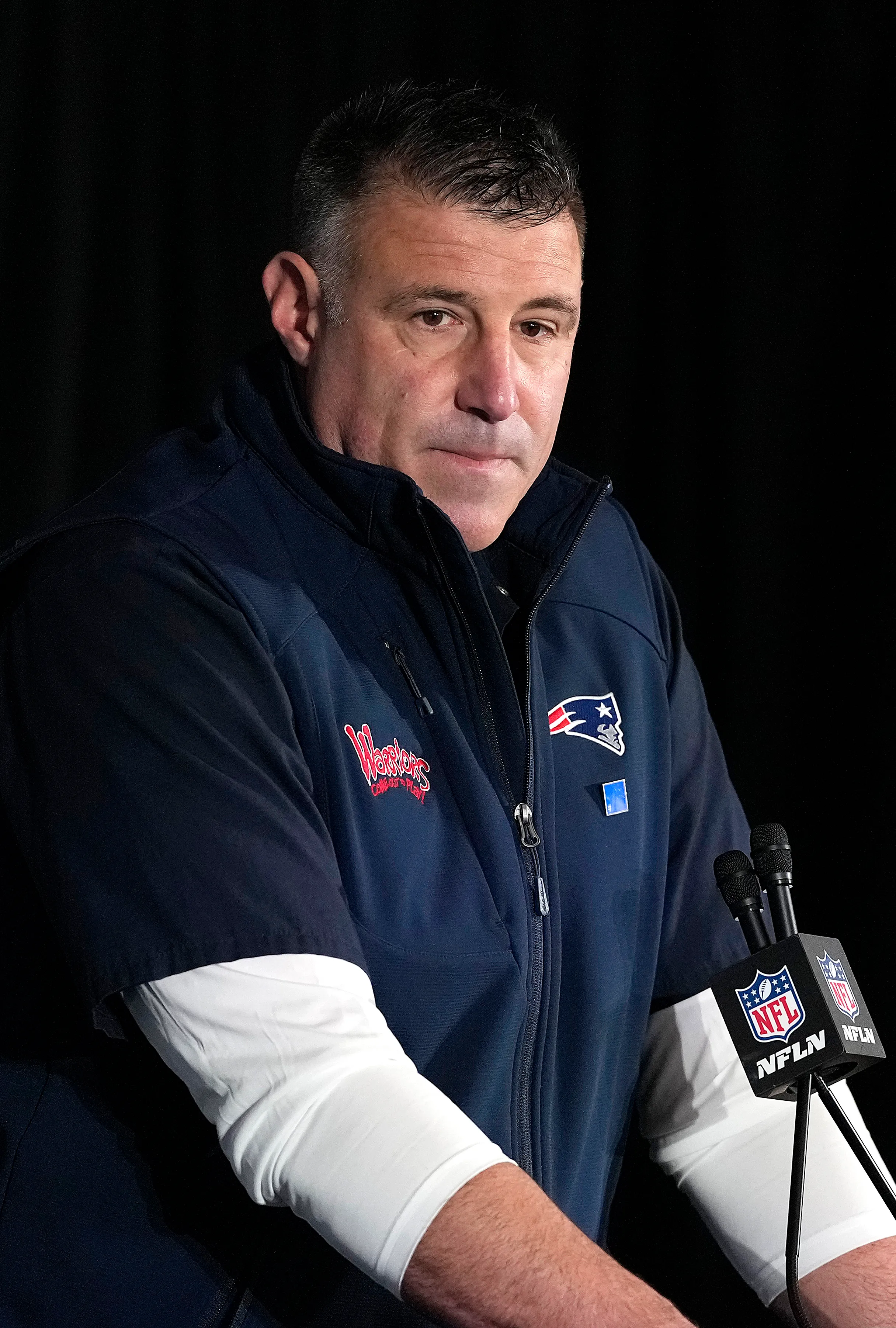 Head coach Mike Vrabel addresses the media at a press conference.