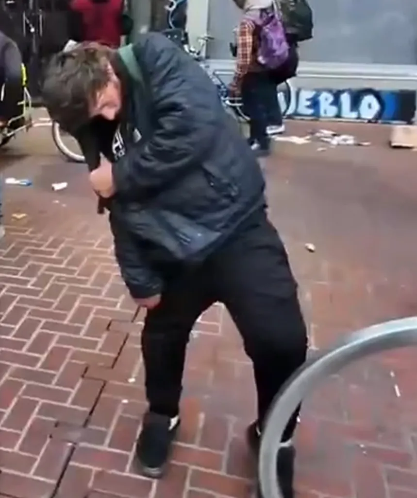 A man appearing disoriented and distressed on the streets of San Francisco.