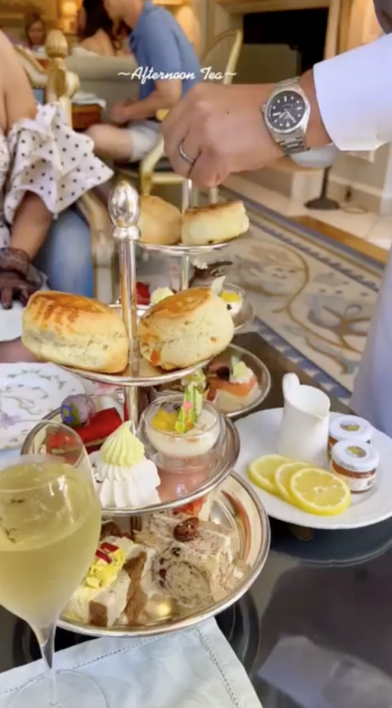 Afternoon tea at The Peninsula Beverly Hills, with a three-tiered platter of scones, pastries, and finger sandwiches.