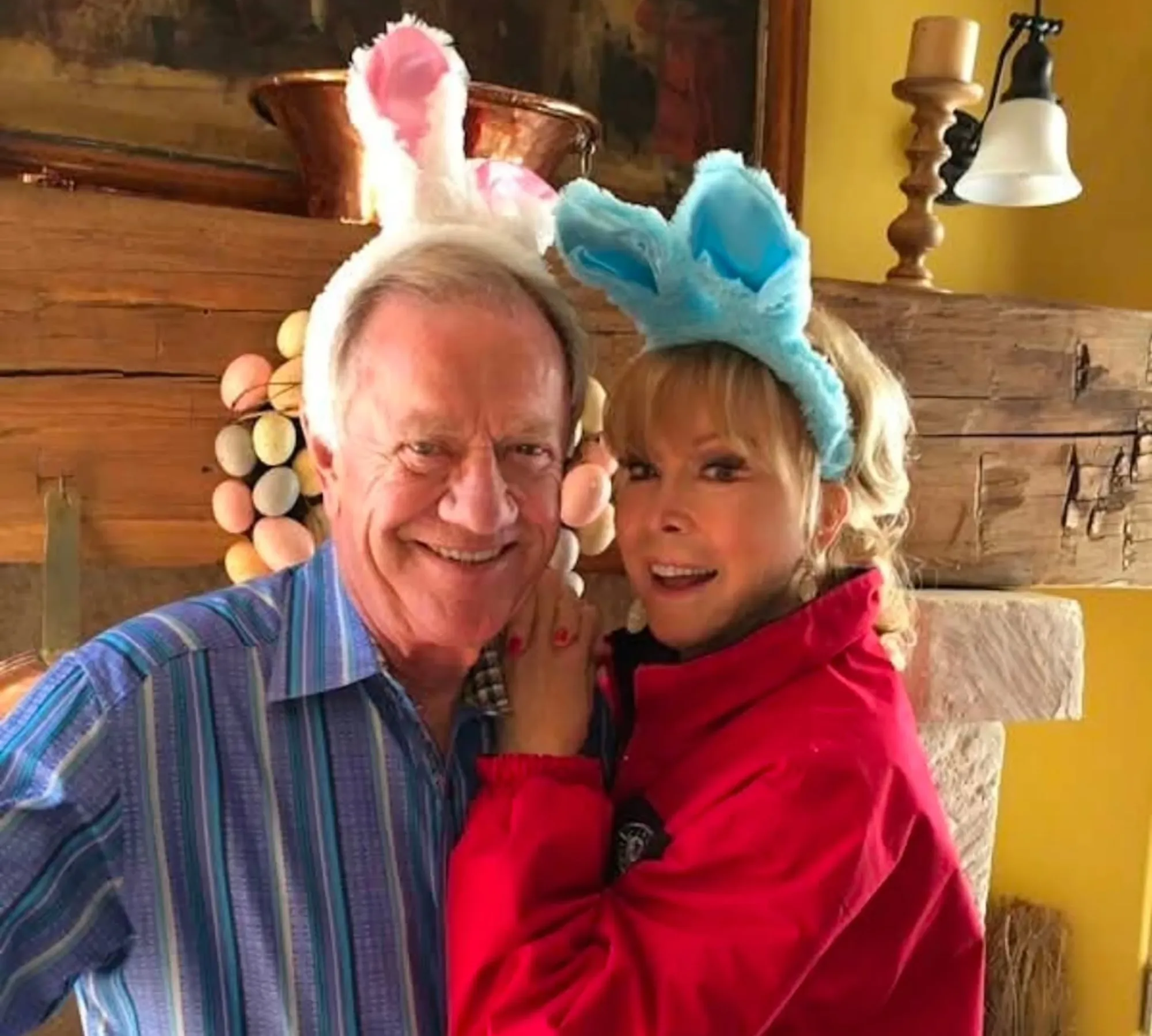 Barbara Eden and Jon Eicholtz wearing bunny ears.