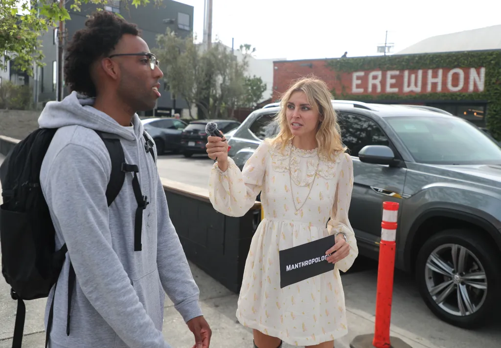 Influencer Holly Solem interviewing a man for her "Manthropology" channel outside Erewhon.