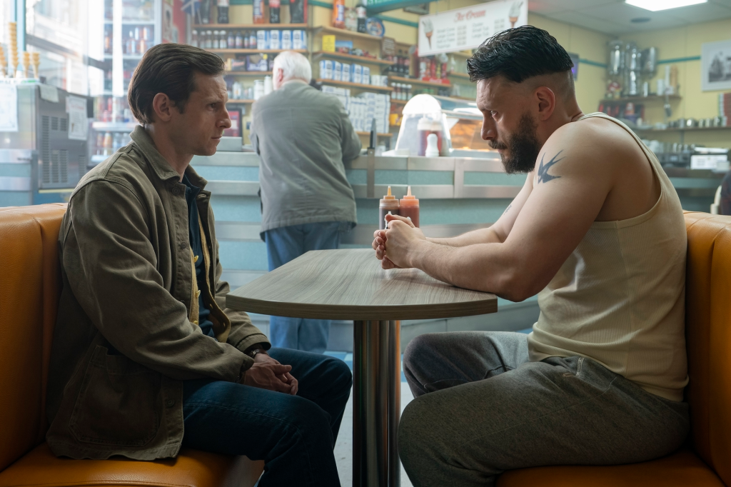 Jamie Bell and Richard Gadd sitting opposite each other at a diner booth.